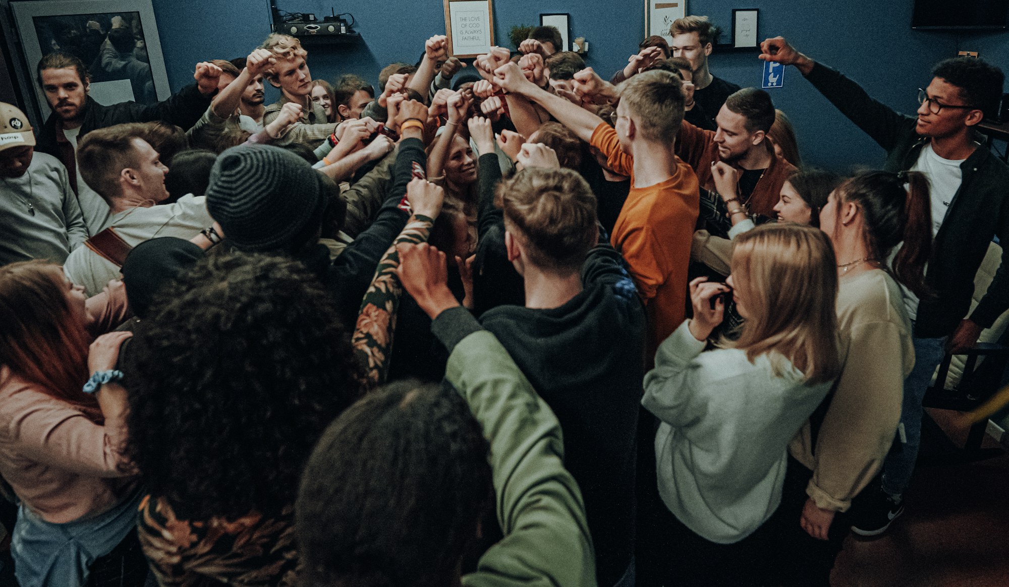 Young adults gathered together in a classroom community